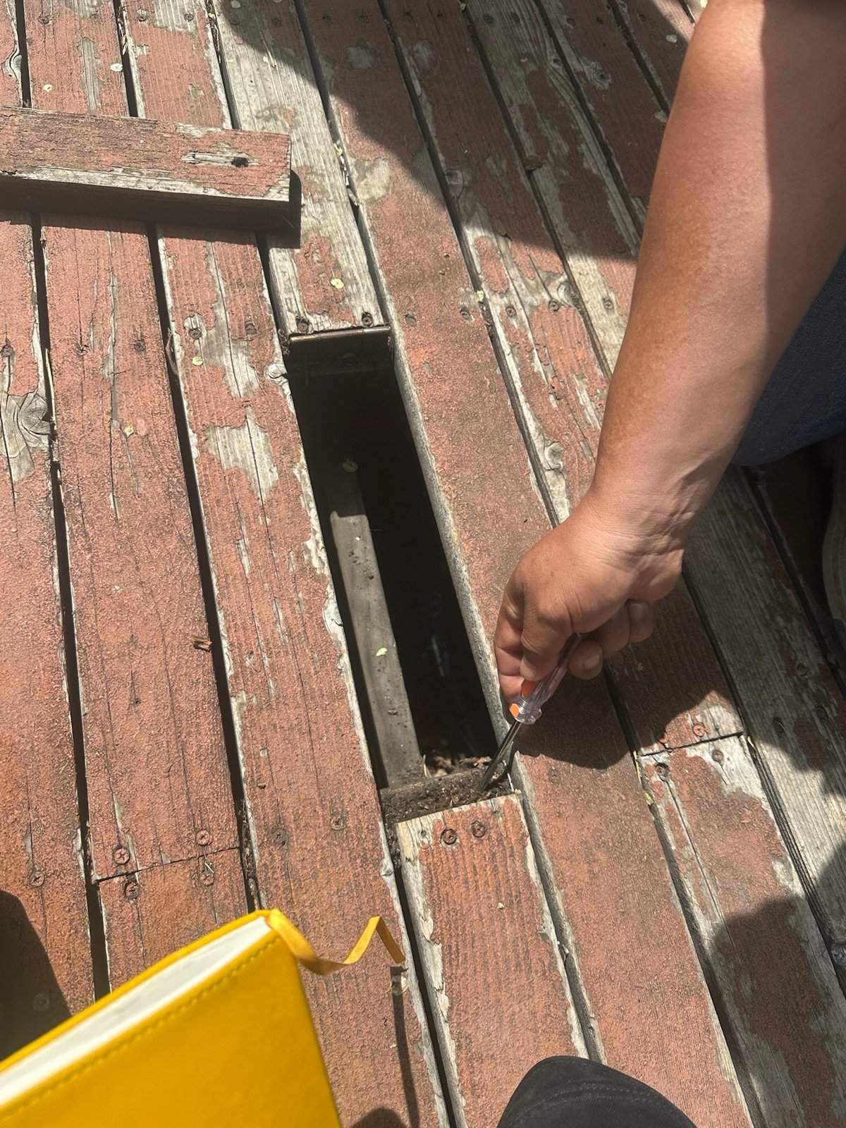 Removing a failed deck board during a repair visit