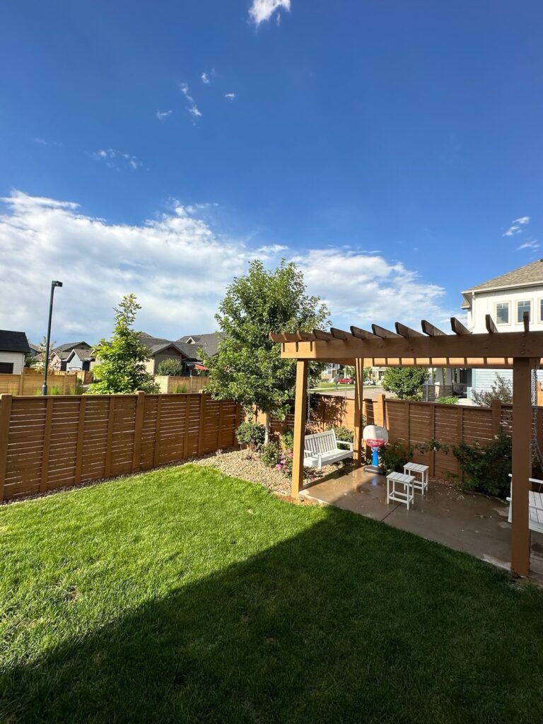 Stained fence pergola patio